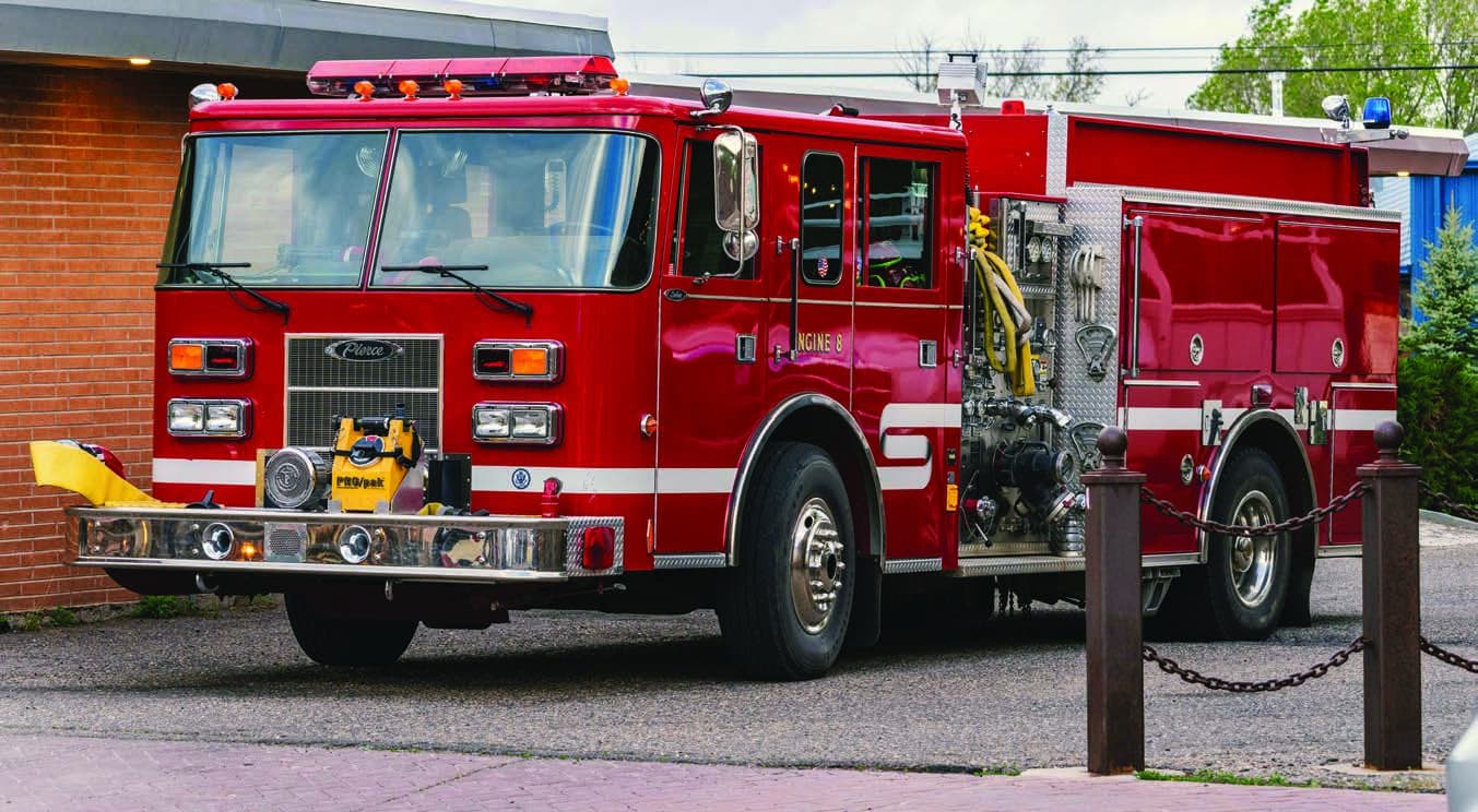 Red fire apparatus parked at a fire station